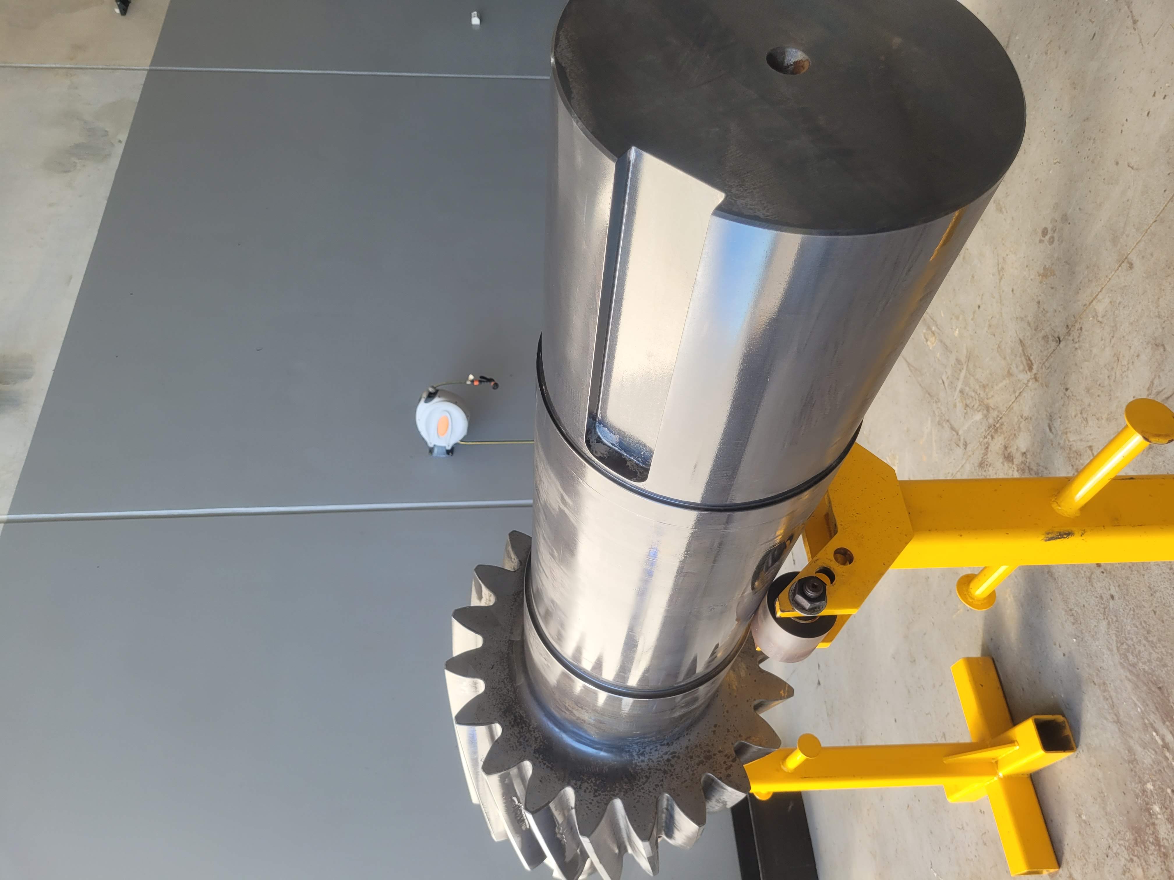 Clean industrial pinion shaft after laser cleaning with original surface preserved