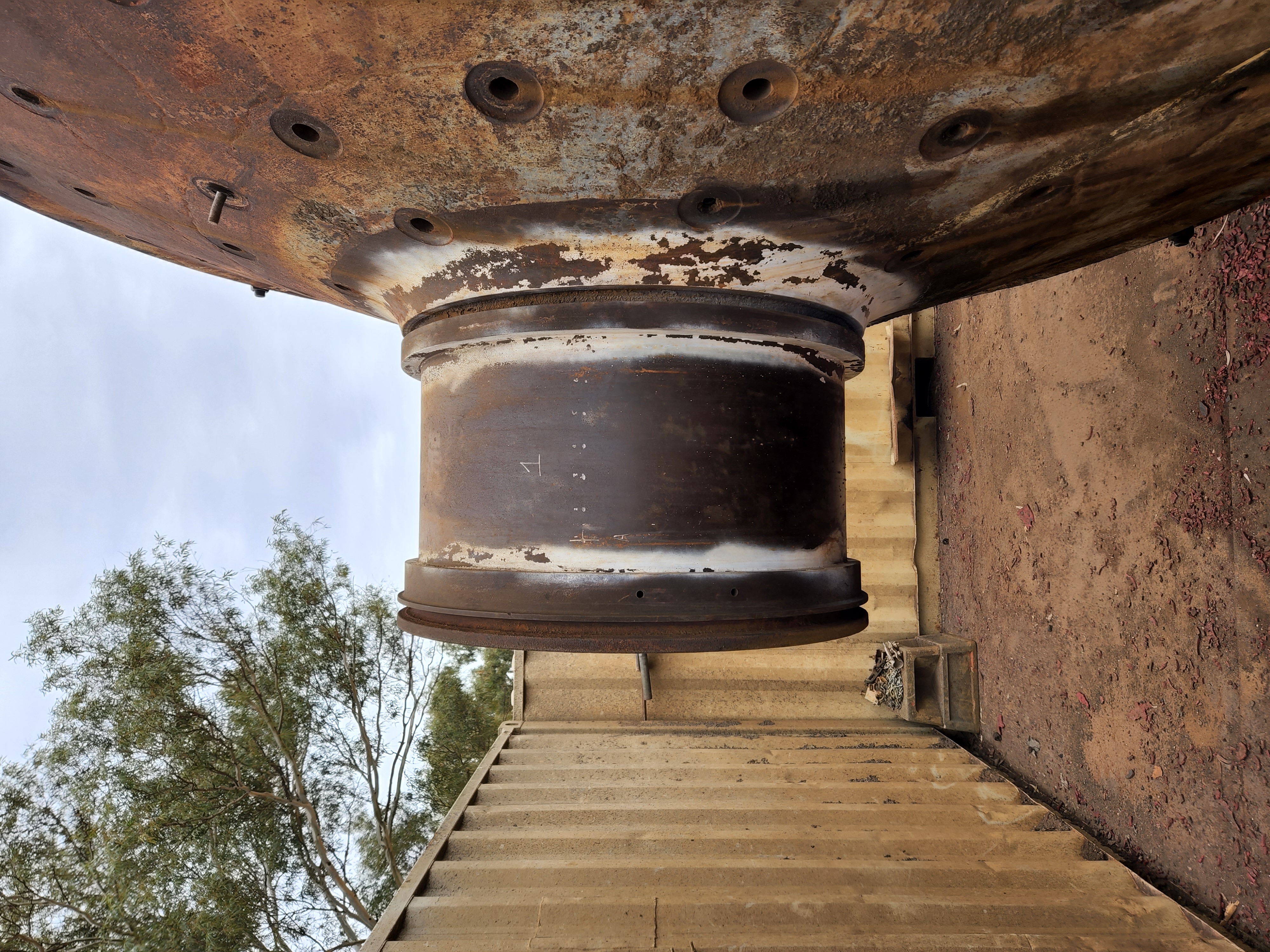 Industrial trunnion with heavy rust and scale before laser cleaning