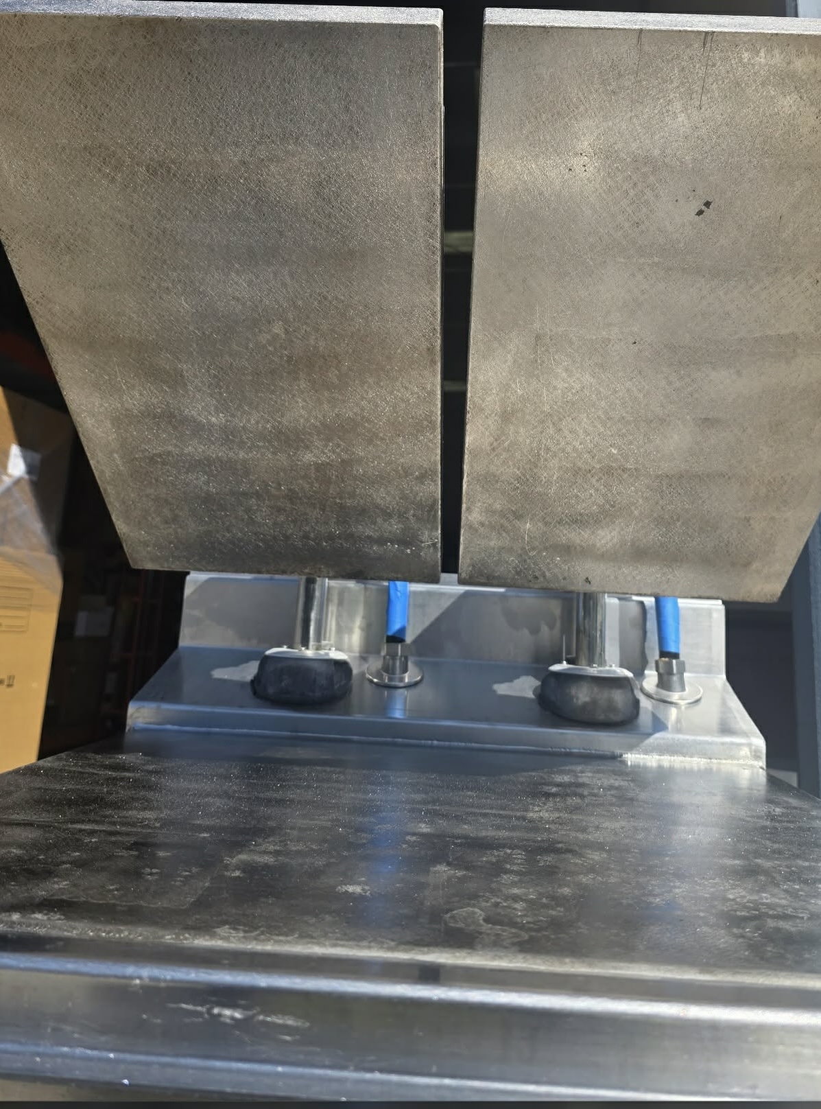 Commercial kitchen flat top griddle restored to clean stainless steel after laser cleaning