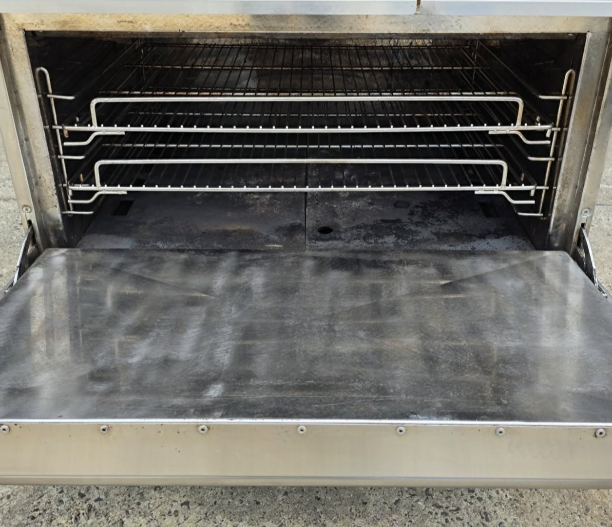 Commercial oven interior with clean surface after laser cleaning