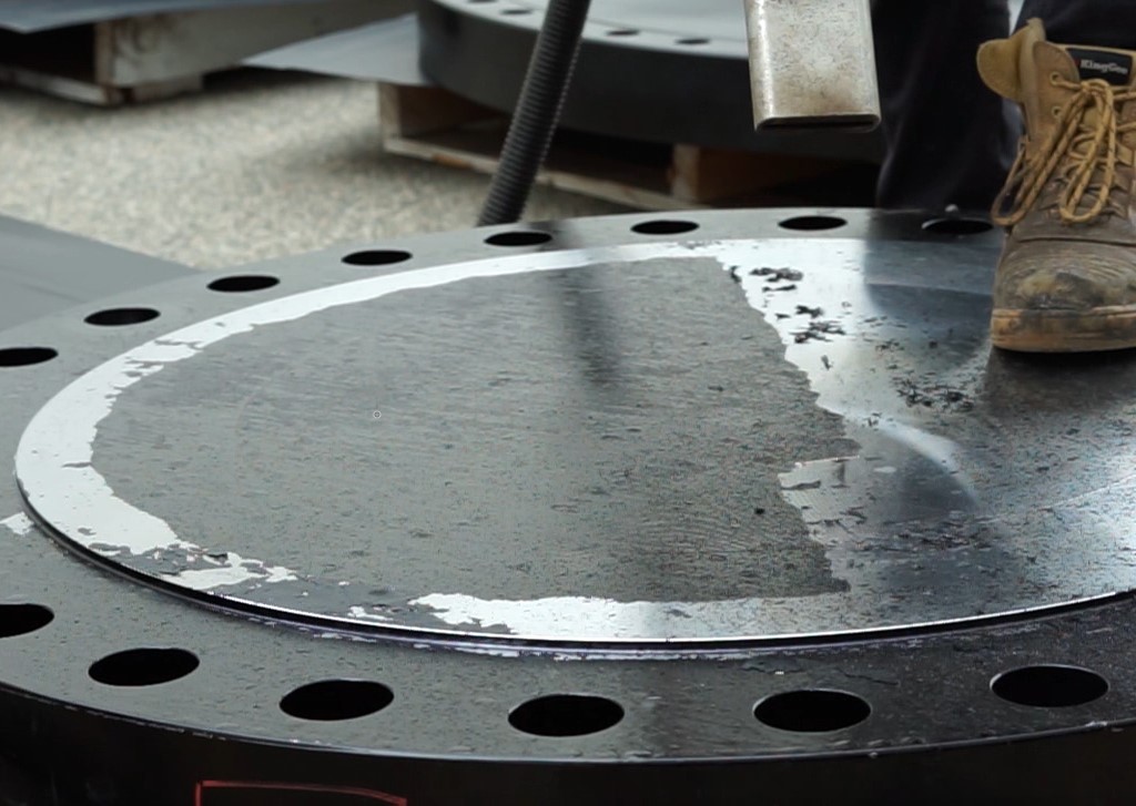 Industrial component during coating removal with laser cleaning