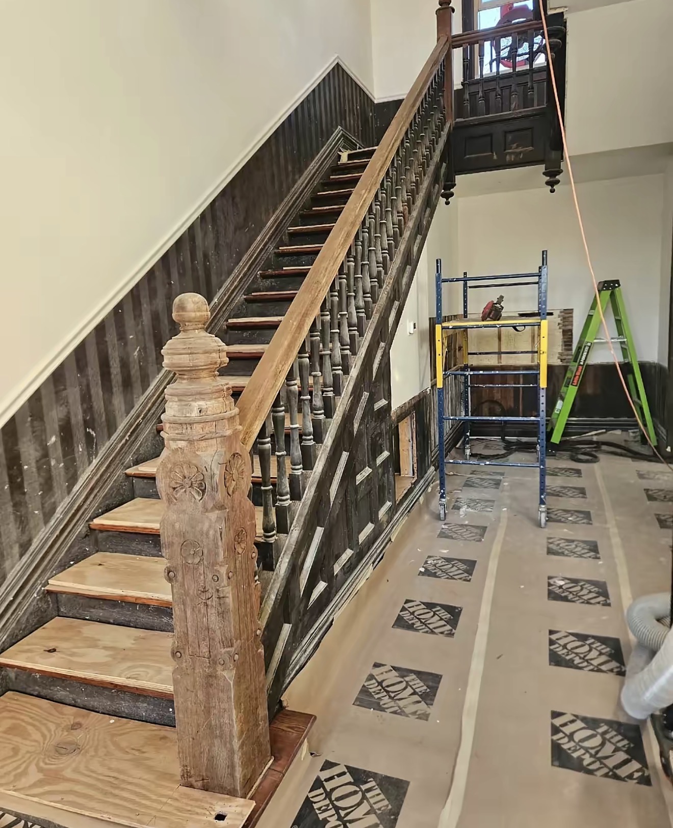 Wooden staircase restored with laser cleaning showing clean natural wood grain