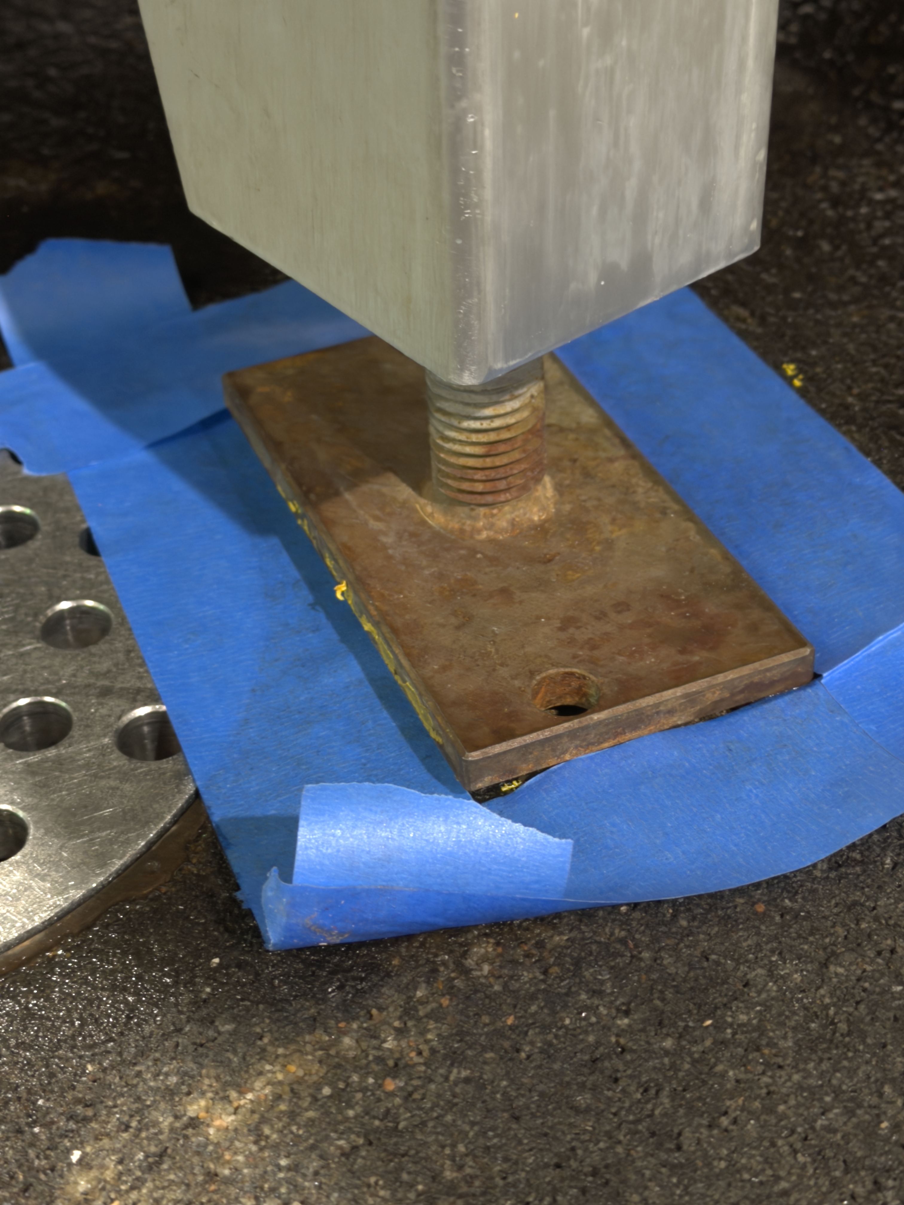 Equipment base with heavy layered rust before laser cleaning