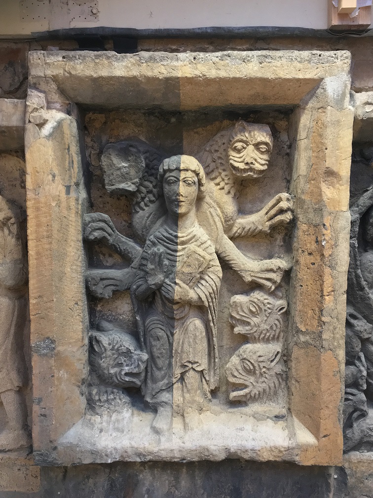 Historic stone relief sculpture being carefully cleaned with laser technology